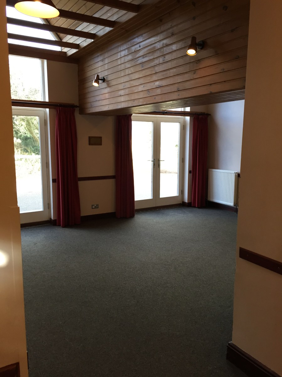 Smaller side room with serving hatch and bar access